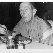 Man Eating at a Restaurant