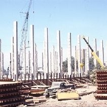 Site of the Downtown Plaza Parking Garage, Lot "G" near Macy's Department Store, 4th, 5th K and L Streets under construction. This view is looking east from the Fratt Building in Old Sacramento