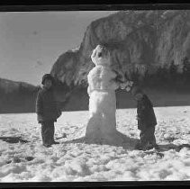 Snowman and two children