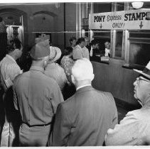 Frank S. Christy is first in line at the Post Office window