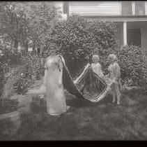 Unknown Women with gown and attendees