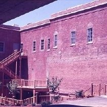 Old Sacramento. View of the Heywood Building before reconstruction on 2nd Street, east side between J and K Streets