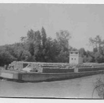 Barge hauling freight on the river