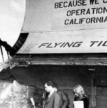 Governor Edmund G. Brown, Jr. and Llewellyn C. Werner (co-founder of Operation California) tour a plane carrying food and medical supplies destined for Cambodia