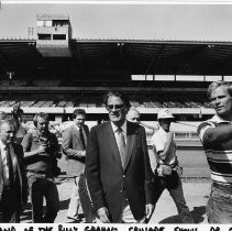Billy Graham, center, being shown around the Cal Expo Grandstand area by his aide Greg Stand (right)