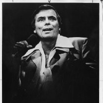 Peter Marshall, entertainer and television personality, singing with microphone