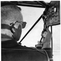 View of the California Highway Patrol's airplane. An officer is using a stop watch