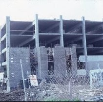 Site of the Downtown Plaza Parking Garage, Lot "G" near Macy's Department Store, 4th, 5th K and L Streets under construction. This view is looking east from the Fratt Building in Old Sacramento