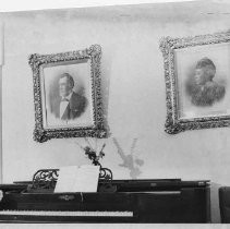 Portraits of the Stanfords over piano inside Stanford Home