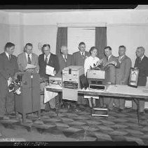 Men looking office equipment