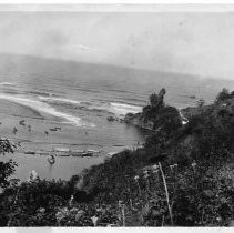 "Mouth of Klamath River, First white man to visit this spot was Big John Turner, June 6, 182 as recounted by the Yurok Indians, per Robert Spott. Yurok Indian village "Rekwoi" on side hill on right hand side of picture. Taken about '45