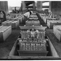 State crews unpack crates holding pilasters that will not be used in the California State Capitol restoration project