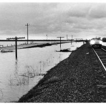 Flood Waters Approach Railroad Tracks