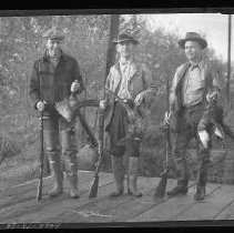 Hunters with dead pheasants