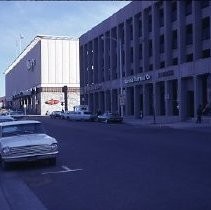 View of Macy's Department Store next to Capital Clothing Company on the right