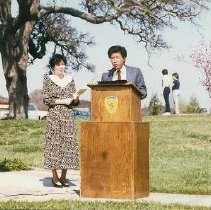 Walerga Park Plaque Dedication: Unidentified Speaker at Podium with Woman