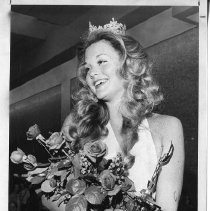 Kirsten Kroner selected Miss Metropolitan Sacramento, 1977, at Florin Mall, shown with trophy and flowers