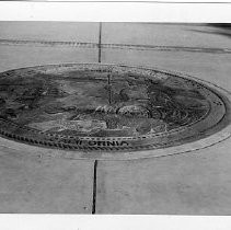 View of the California State Seal embedded on the grounds of the State Capitol