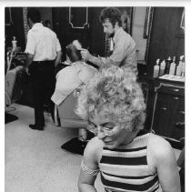 Krickett Howard, shining shoes in a barber shop