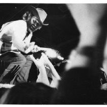 Alan Jardine reaches out to touch his audience. Jardine, here on stage with his guitar, was a founding member of the Beach Boys