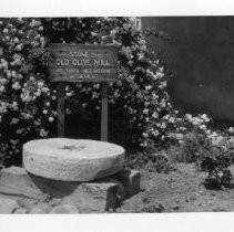 Close-up view of a grinding stone at Mission Santa Ines, California State Landmark #305 in Santa Barbara County