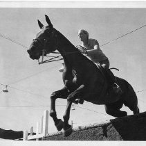 Anne Kursinski puts her horse Jessica through a jump