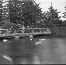 Group of people on wooden bridge