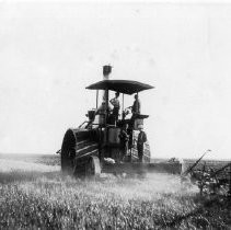 Farm scene plowing a field