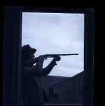 Man aiming a rifle