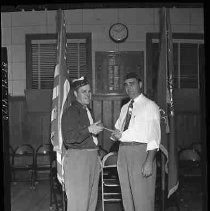 Two veterans holding a gavel