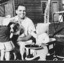 David W. Joslyn with his daughters and dog Pal