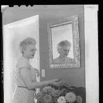 A woman arranging flowers