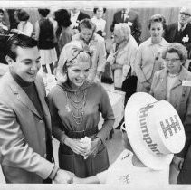 Robert A. Humphrey, son of V.P. Hubert Humphrey, shakes hands with a Humphrey supporter as his wife Donna, watches. They were in Sacramento campaigning for Humphrey for President