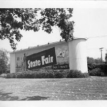 View of a sign advertising the California State Fair in 1949, which celebrated the centennial of the Gold Rush that year