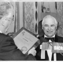 J. W. Kipper receiving a plaque (possibly 1973 Sacramentan of the Year Award)