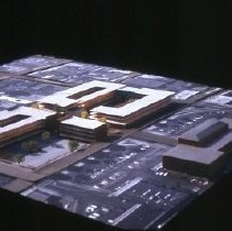 Views of redevelopment sites, renderings, and table models for the proposed Redevelopment District. Includes maps and site plans. This view shows a table model