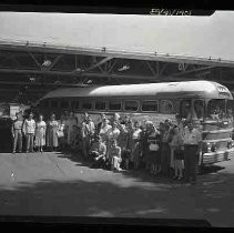 Veterans next to a bus