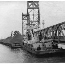 View of the tugboat, Tyee of Vancouver, Washington seen pulling a bargeload of sand,Off Course Barge