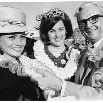 Camellia Queen Joan Martin (center) with Miss Hawaii Loretta Ann Perreia and Vince Caselli