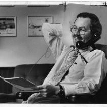 Phillip Isenberg, Sacramento City Councilman, Mayor, Assemblymember. He is shown in his office, on the phone