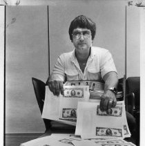 C.W. Hamilton, Secret Service Agent, with counterfeit money confiscated in Stockton