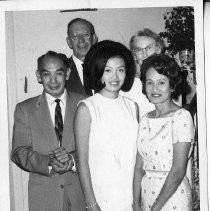 Josie Leong, Miss Chinatown USA, with her parents, Mr. and Mrs. Joseph Leong, and (background), Mr. and Mrs. Melvin Morse