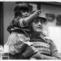 Robert Hohman, father of former hostage Don Hohman, with a family member (likely his granddaughter, Hohman's niece), waits to greet the ex-hostage at the airport