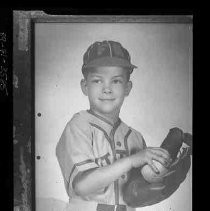 Boy in baseball uniform