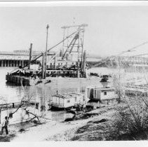 View of the United States Engineers dredger on the Sacramento River between I and M Streets