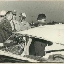 George Nielsen and deputy coroner, Loren Willeford, at crash scene