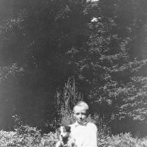 David Lester Cole as a boy with his puppy