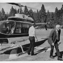 Harold T. "Bizz" Johnson, California state senator (1948-1958) and U.S. Congressman (1958-1981). He was known for his work as the chairman of the House Public Works Committee. Here, he disembarks from a helicopter in Butte County