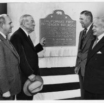 View of the plaque for California's First Passenger Railroad, the Sacramento Valley Railroad in Sacramento County, California State Landmark #526 Sacramento County. From the left: C. L. Mason, president of Thomson Diggs, Company, Joseph R. Knowland, president State Park Commission, J. W. Corbett, vice president, Southern Pacific Railroad, and Ted Baggelman, president, Sacramento County Historical Society at the dedication