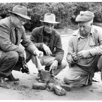 Photographs from Russian Fort Inspection at Bodega Bay. Inspecting bricks and artifacts at Bodega Bay, May 13, 1954, L to R - J. A. Hussey, Park Ranger, G. P. Hagens, R.S. Coon (?)